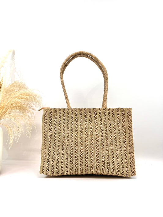 Sac cabas tressé à finitions dorées éclat solaire